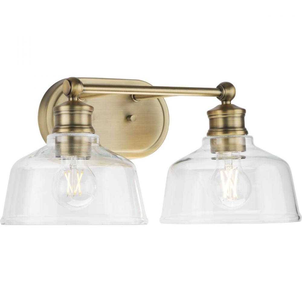 Singleton Collection Two-Light 17" Vintage Brass Farmhouse Vanity Light with Clear Glass Shades